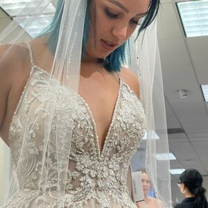 Elegant Beaded Wedding Dress with Veil